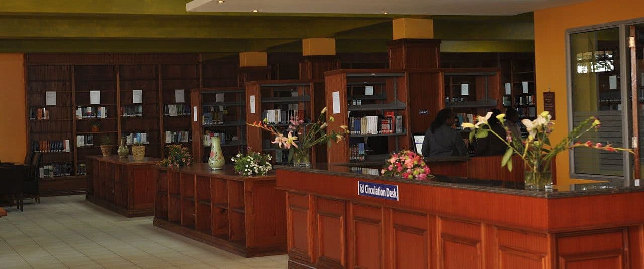 Library staff at the circulation desk in Riara University Library